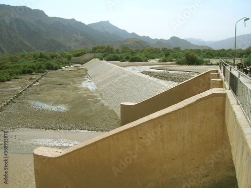 A weir in a wadi near Aden, Yemen, built to divert flash floods into an irrigation canal. 