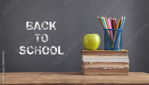 Back To School. Books, apple, pencils