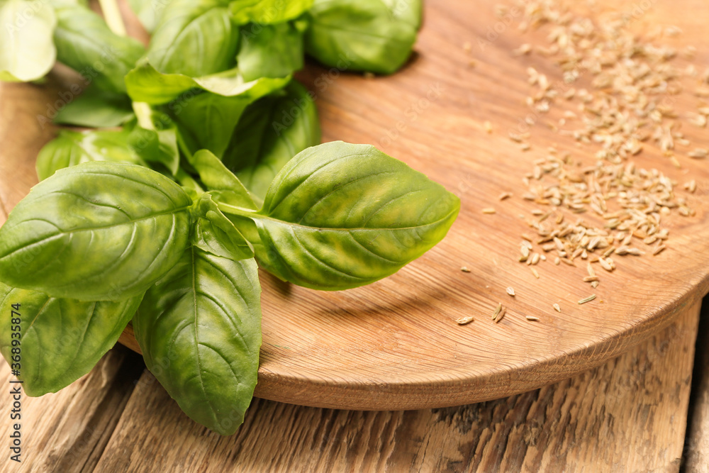 Fresh basil on wooden background, closeup Fresh basil on wooden background, closeup