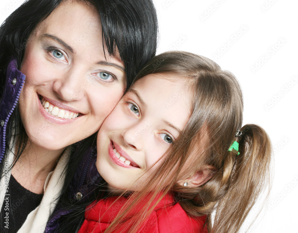 mother and her daughter smiling at the camera mother and her daughter smiling at the camera