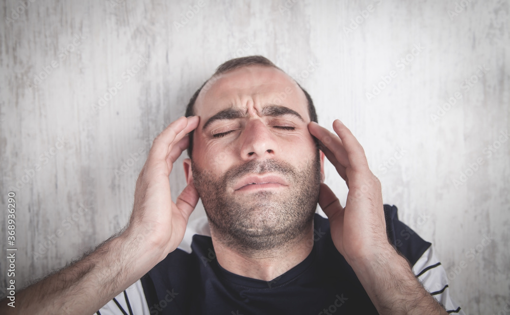 Caucasian man suffering from headache. Caucasian man suffering from headache.
