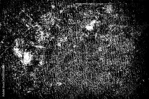 Dirty grunge background. The monochrome texture is old. Vintage worn pattern. The surface is covered with scratches