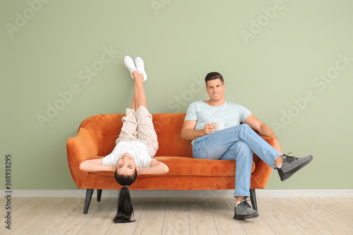 Young couple relaxing on so...