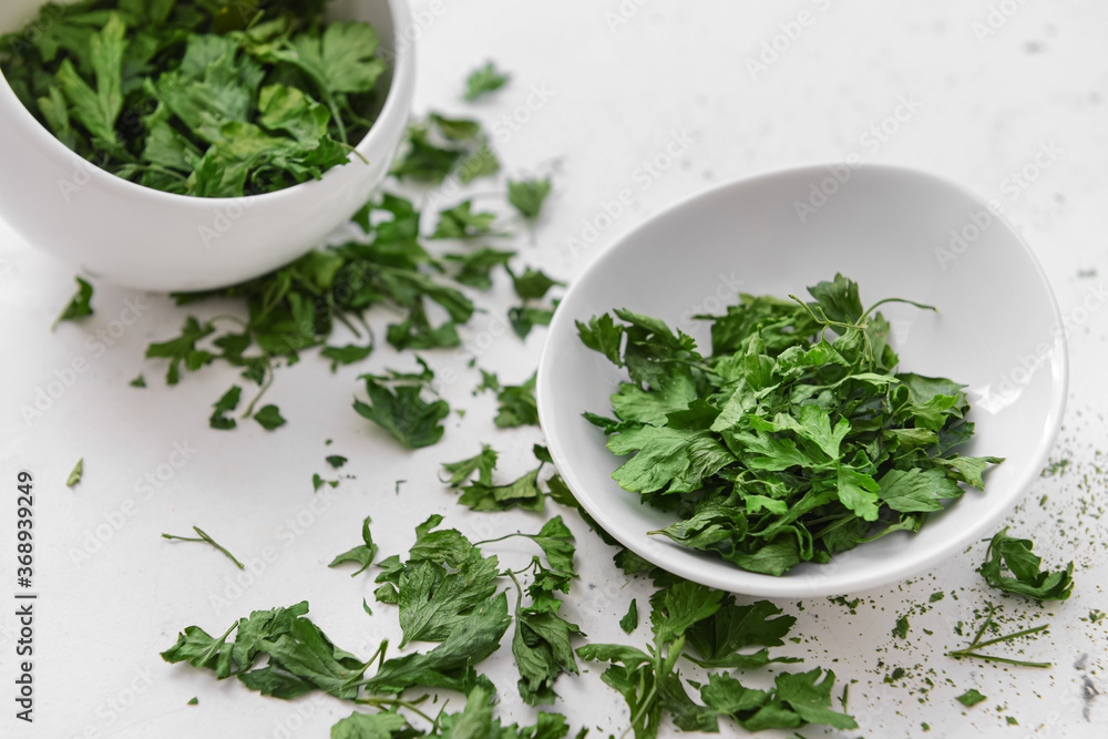 Plate with dry parsley on white background Plate with dry parsley on white background