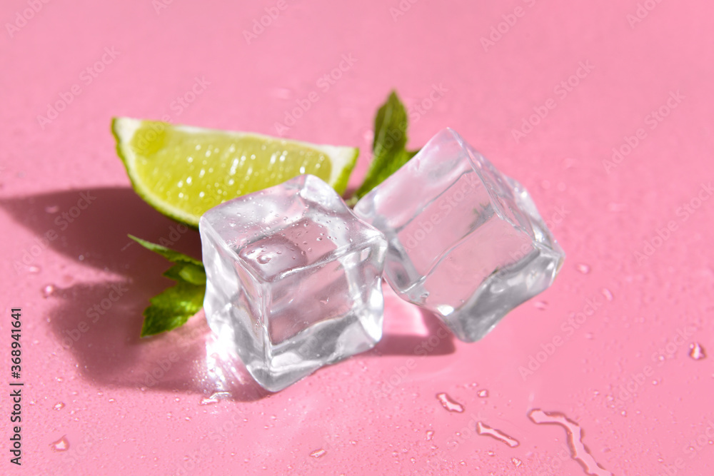 Ice cubes, lime and mint on color background Ice cubes, lime and mint on color background