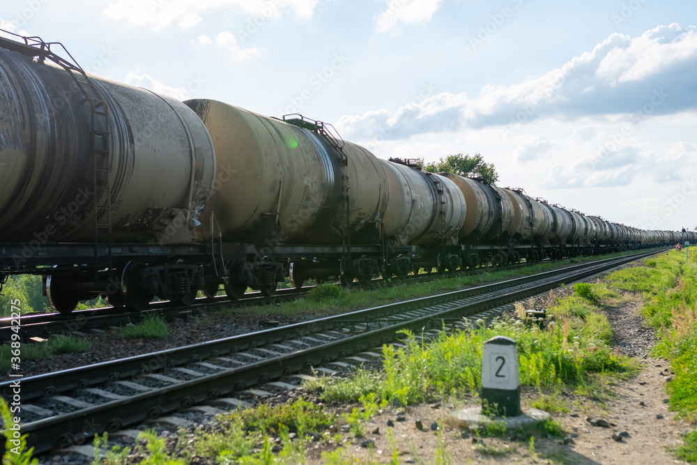 Naklejka premium Old barrels of oil on the railway.