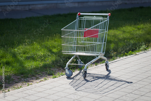 An empty cart for products near the supermarket