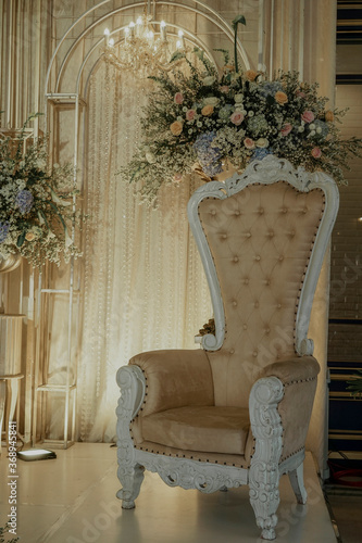 wedding stage decoration with fabric and flower bouquet. flower decoration on wedding backdrop