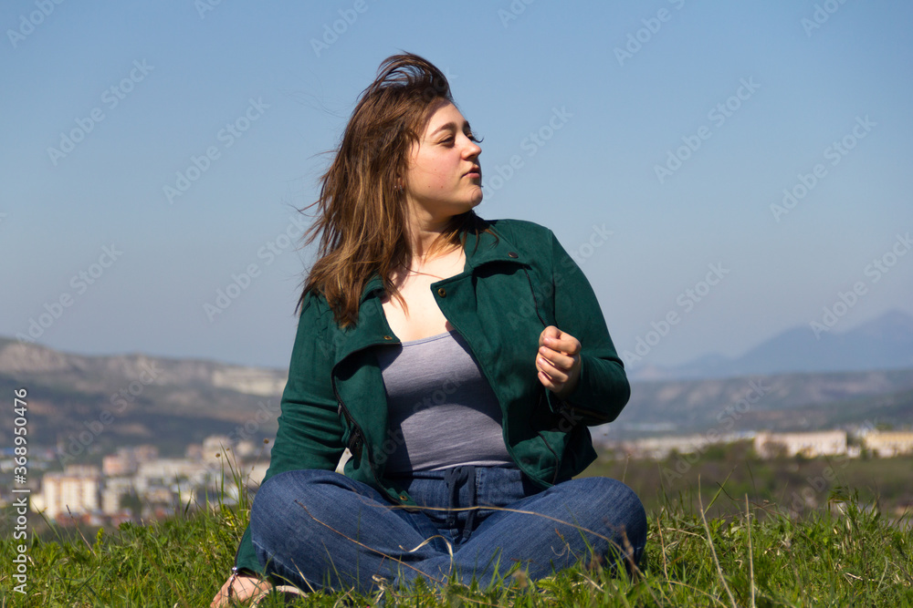 2. Curvy girl on the grass in lotus position. Looks to the right. 2. Curvy girl on the grass in lotus position. Looks to the right.