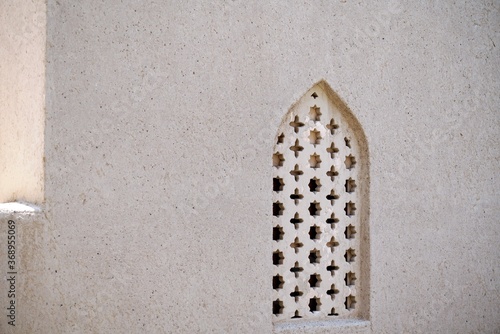 old stone wall and window in mosque 