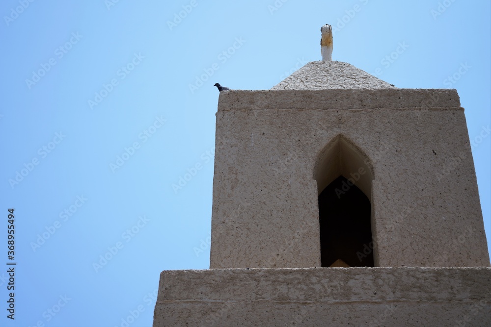tower of the minaret by blue sky