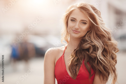 happy fashion woman in red dress outdoor