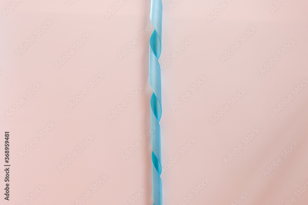 Celebratory blue bow on a white background.
Celebratory blue bow on a white background.