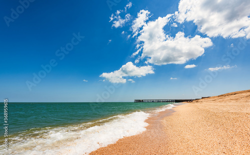 Beach with turquoise sea and yellow sand  resort summer background