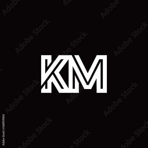 KM monogram logo with abstract line