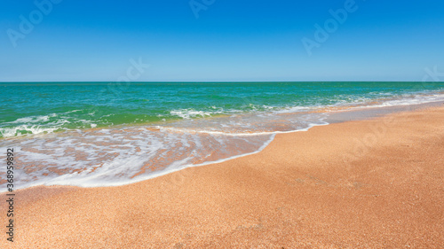Beach with turquoise sea and yellow sand, resort summer background