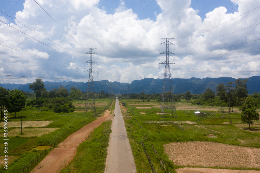 Obraz premium Aerial view of country road to mountain showing scenic view of nature in Laos.