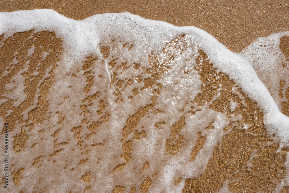 Sea sand with water splash