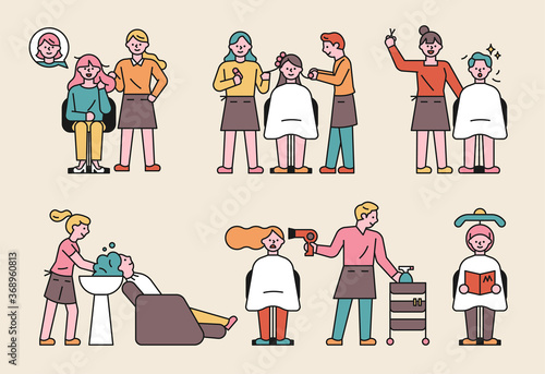 Designers in the beauty salon and guests in robes.