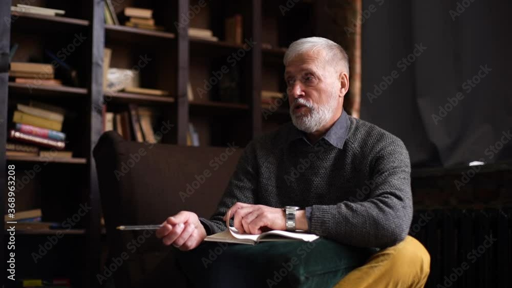 Bearded mature psychologist with gray-hair is supporting and consoling depressed patient. Professional senior psychotherapist is giving healthcare advice to patient during psychological consultation. Bearded mature psychologist with gray-hair is supporting and consoling depressed patient. Professional senior psychotherapist is giving healthcare advice to patient during psychological consultation.