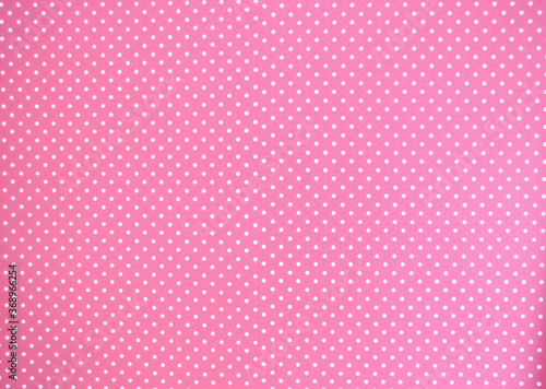 Pink background texture with white polka dots, Pink and white spot pattern can be used for background retro modern design