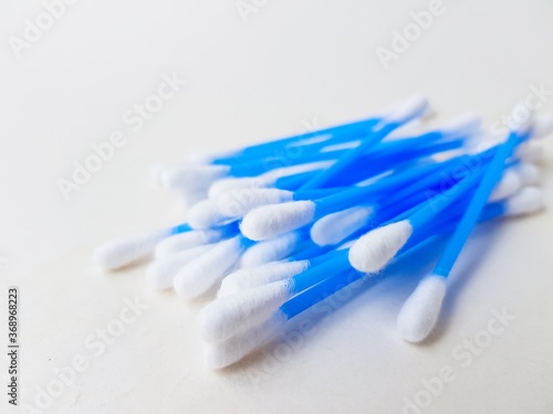 Cotton sticks ear blue plastic on a white background. Personal hygiene and care. Cosmetology and medicine.