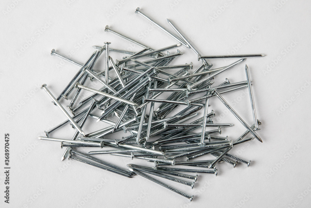Heap of Metal Steel Nails on white background Heap of Metal Steel Nails on white background