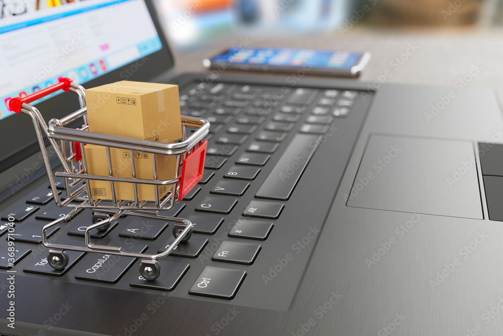 E-commerce symbol - shopping cart, two cardboard shipping boxes, laptop and smartphone - symbols of online shopping and delivery - 3d illustration