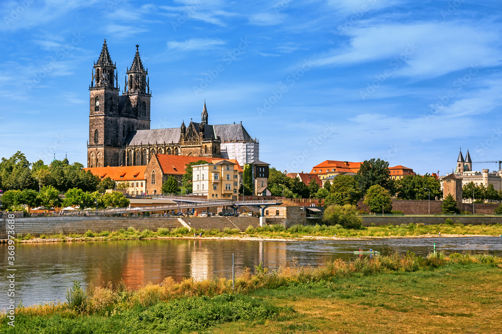 Scenic panoramic view of Magdeburg old town with Magdeburg cathedral, the Elbe river and its embankments in Magdeburg, Germany 