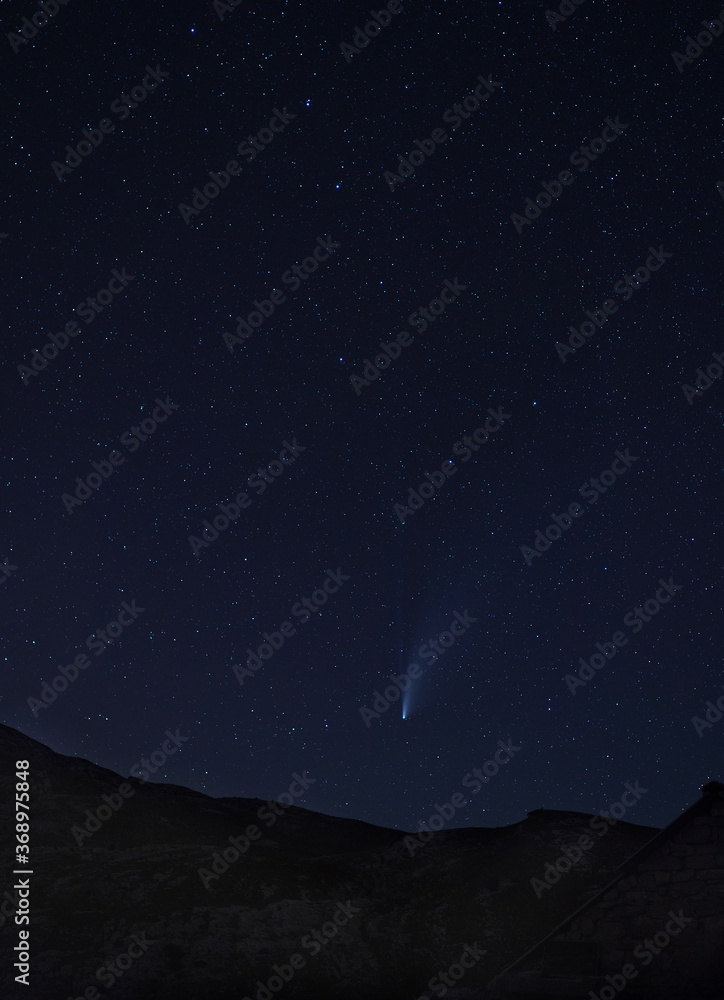 Long period comet C/2020 F3 (NEOWISE) with tail visible in night sky above the Dinara mountain in Dinaric Alps on the border between Croatia and Bosnia and Herzegovina. I