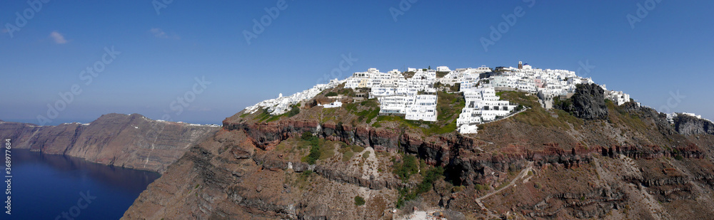 Panoramic view of mountains, sea and nature from Fira town, Santorini island Greece. View of the caldera and ships in the bay.