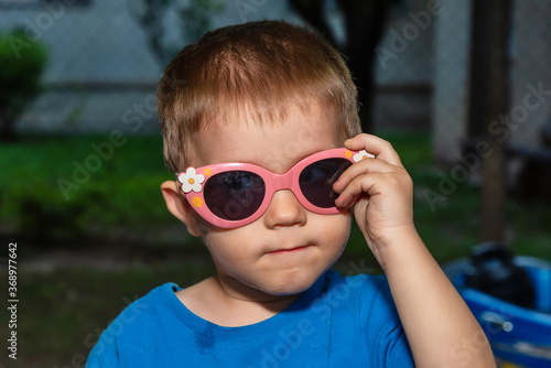 a boy with funny sunglasses