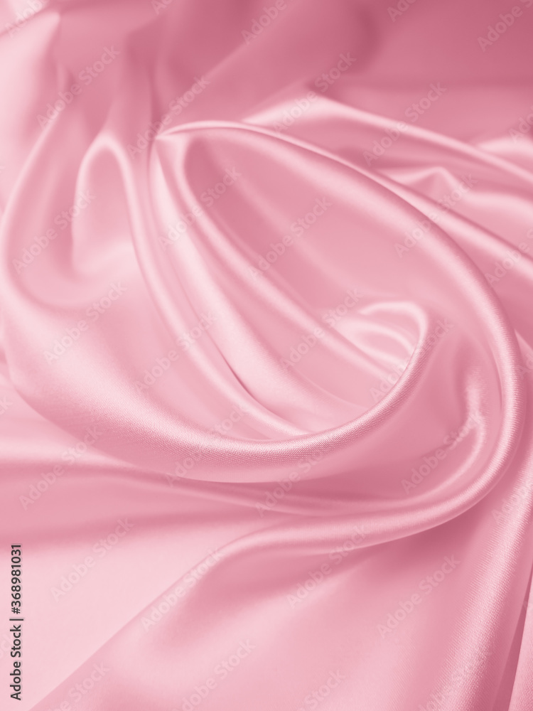 Fototapeta premium Beautiful elegant wavy light pink satin silk luxury cloth fabric texture, abstract background design.