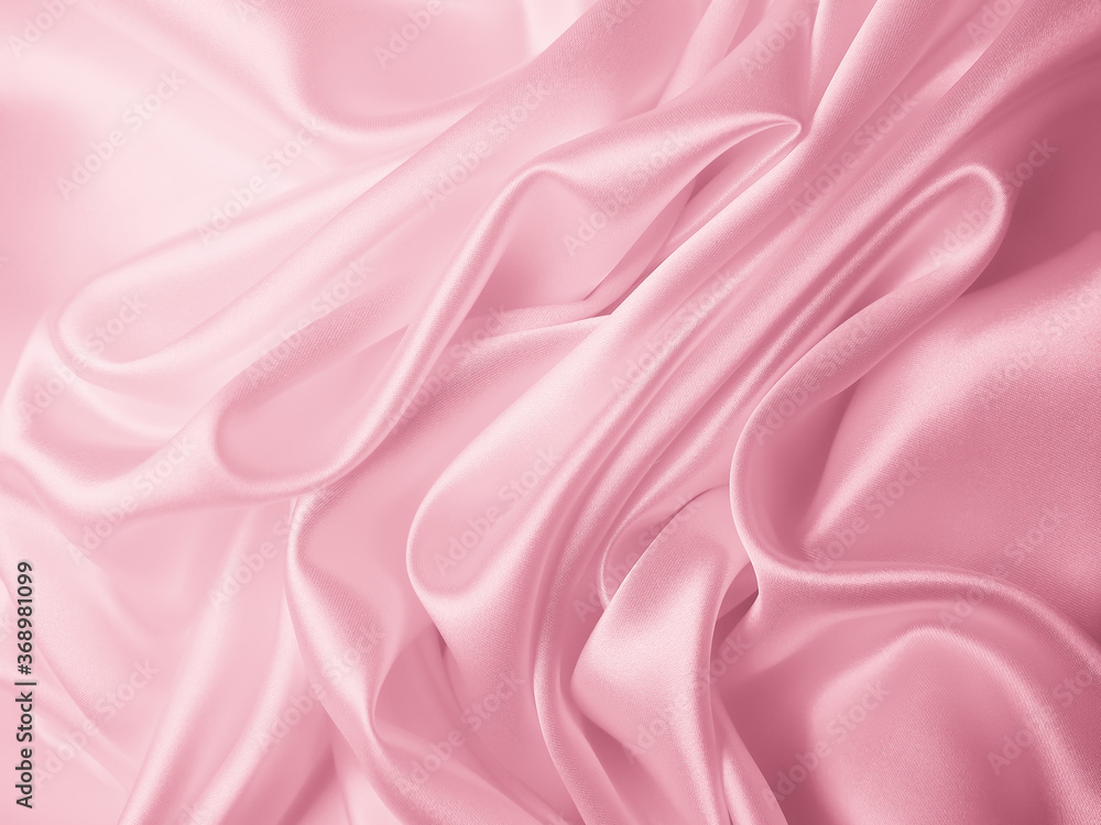 Obraz premium Beautiful elegant wavy light pink satin silk luxury cloth fabric texture, abstract background design. 