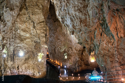 Explore the depth inside the Stopica cave - limestone formation with stalactites, stalagmites and water ponds in Zlatibor, Serbia