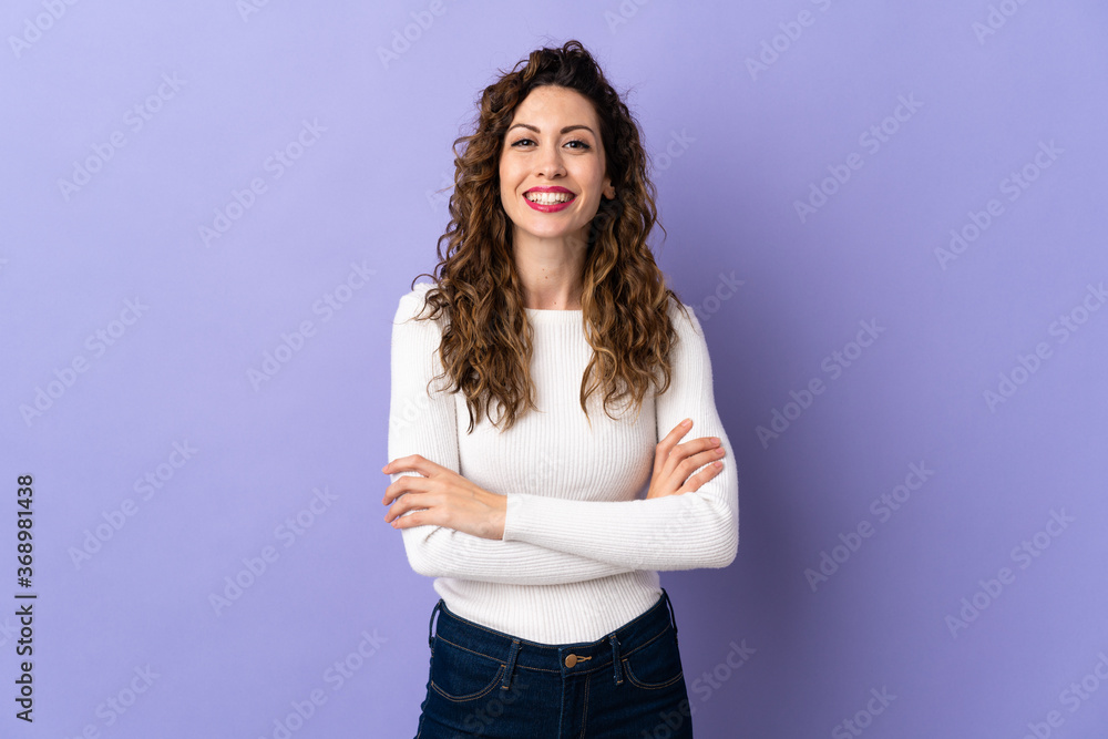 Young caucasian woman isolated on purple background keeping the arms crossed in frontal position Young caucasian woman isolated on purple background keeping the arms crossed in frontal position
