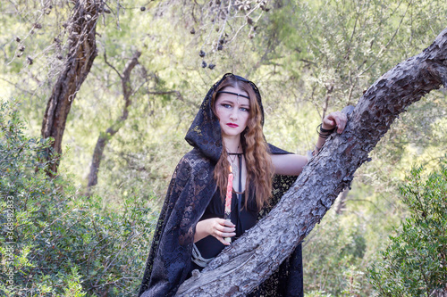 Witch women during Halloween in the forest