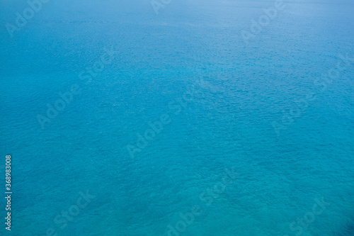 Blue surface of sea. Water is calm, just a little waves from breeze