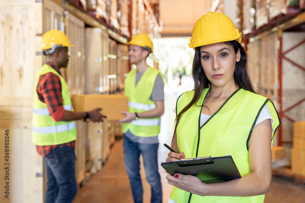 interracial Warehouse worker in distribution warehouse. interracial Warehouse worker in distribution warehouse.