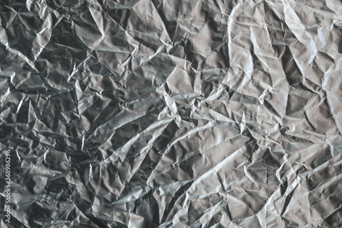 Shiny silver gray foil texture background industry. 