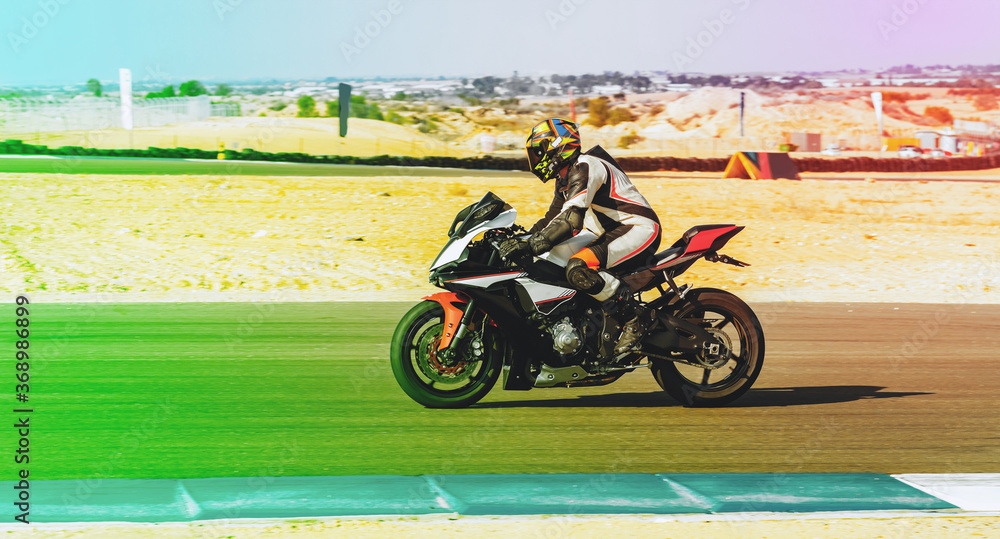 motorcycle racer rides on a sports track motorcycle racer rides on a sports track