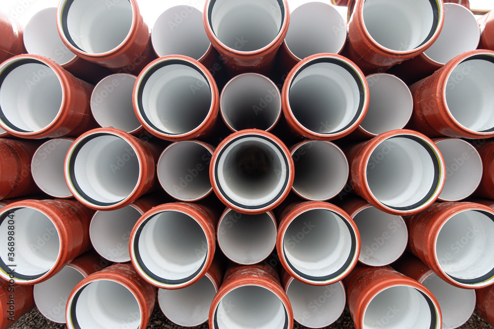 background of colorful big plastic pipes used at the building site. background of colorful big plastic pipes used at the building site.