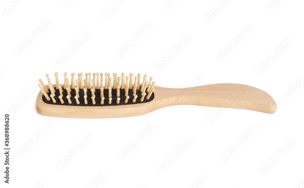 new wooden comb with handle isolated on white background new wooden comb with handle isolated on white background