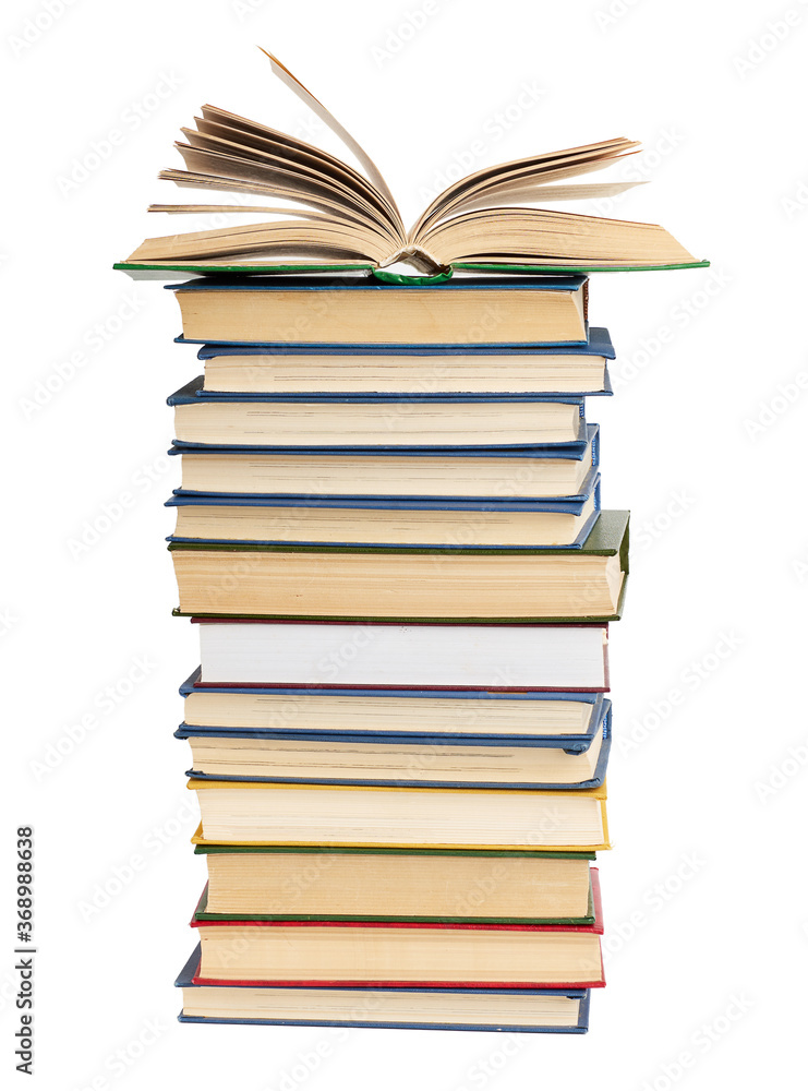 stack of various books, on top an open book, items are isolated on white background stack of various books, on top an open book, items are isolated on white background