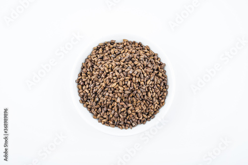 A saucer of cassia tea on white background