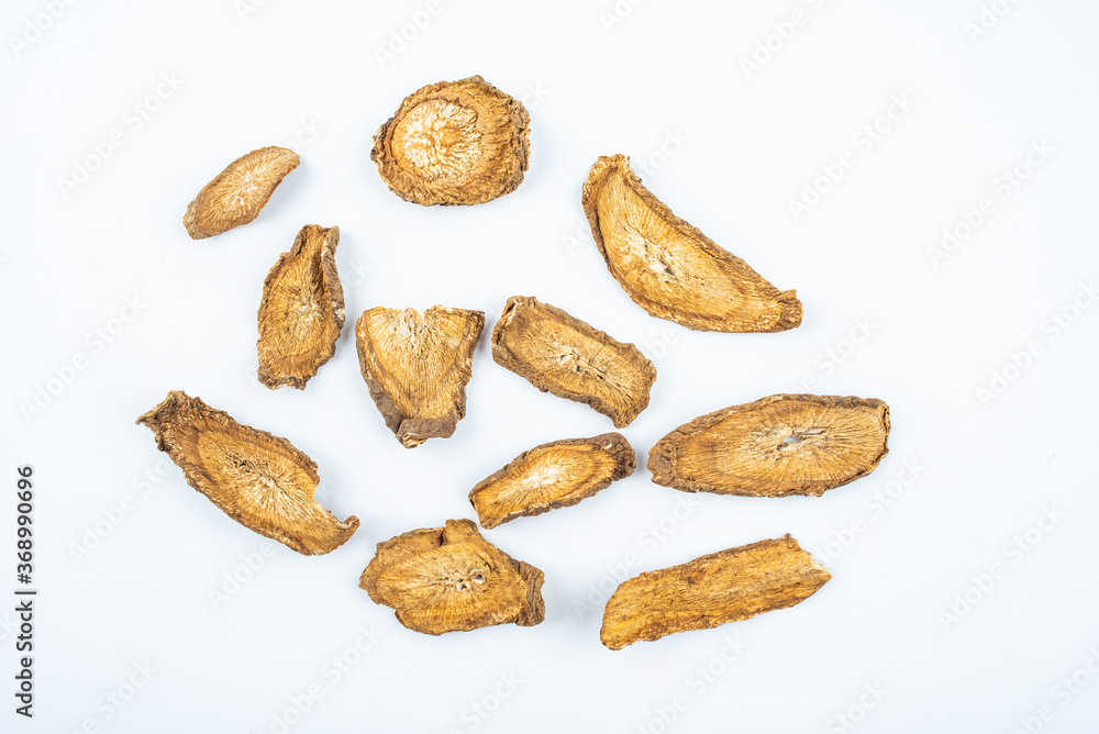 Obraz premium Chinese herbal medicine burdock root slices on white background