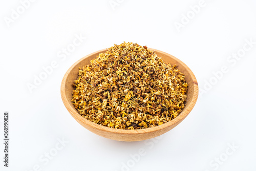 Osmanthus tea in a saucer on white background