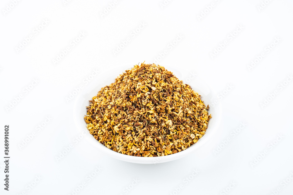 Osmanthus tea in a saucer on white background Osmanthus tea in a saucer on white background