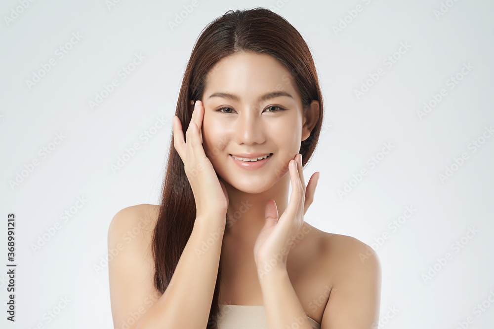 Beautiful Young asian Woman with Clean Fresh Skin on white background, Face care, Facial treatment, Cosmetology, beauty and spa, Asian women portrait Beautiful Young asian Woman with Clean Fresh Skin on white background, Face care, Facial treatment, Cosmetology, beauty and spa, Asian women portrait