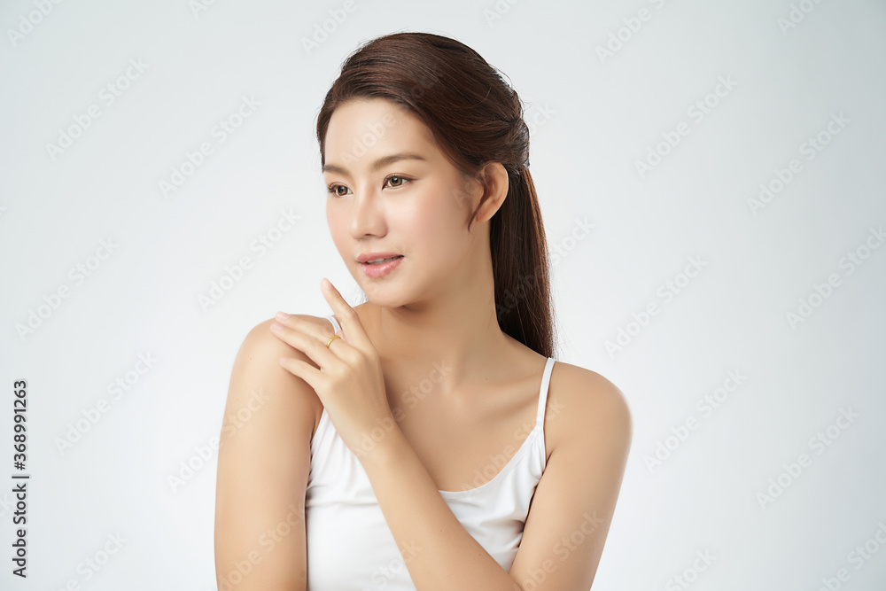 Beautiful Young asian Woman with Clean Fresh Skin on white background, Face care, Facial treatment, Cosmetology, beauty and spa, Asian women portrait Beautiful Young asian Woman with Clean Fresh Skin on white background, Face care, Facial treatment, Cosmetology, beauty and spa, Asian women portrait